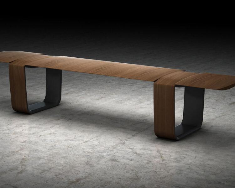 A wooden bench made from a walnut-toned wood with wooden loop style bases. The top and loop bases have a knife edge detail.
